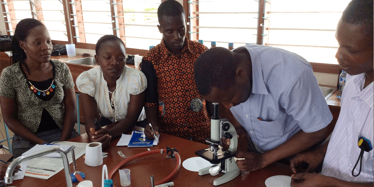 Open University of Tanzania students working on a practical