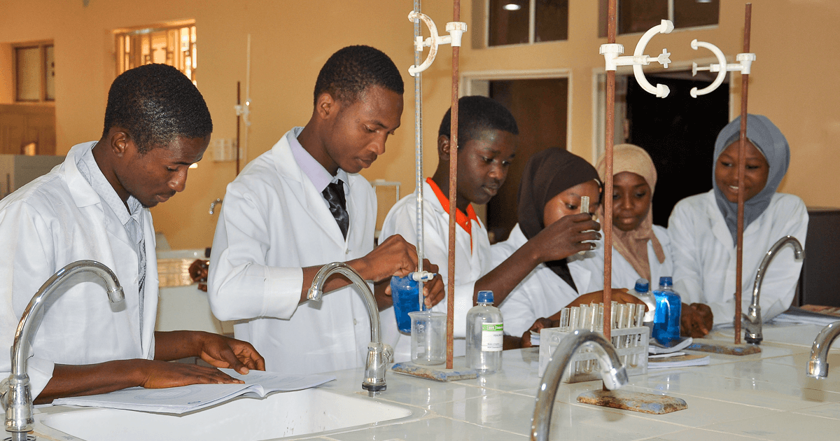 A group of 200-level biochemistry students performing a practical in the undergraduate biochem lab