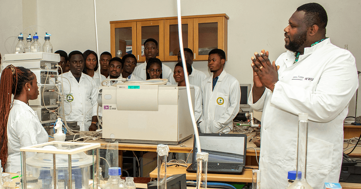 Dr. Benjamin Harley and students in a lab practical in the College of Pharmacy at UHAS